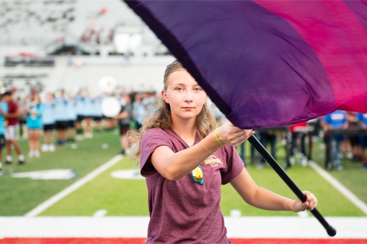 girl twirling flag